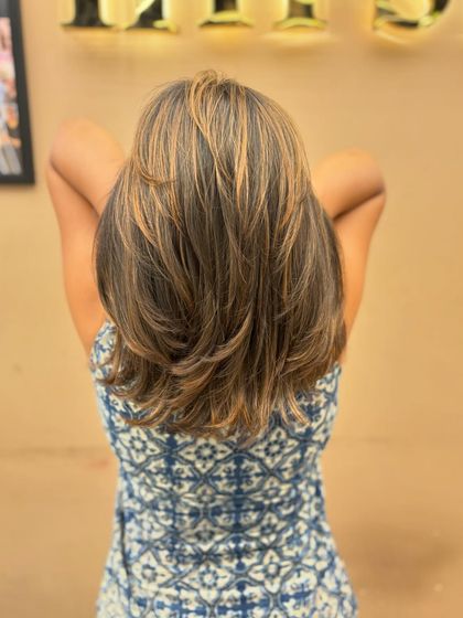 Another angle of a client's layered cut and color, showing the dimension and texture from the back.