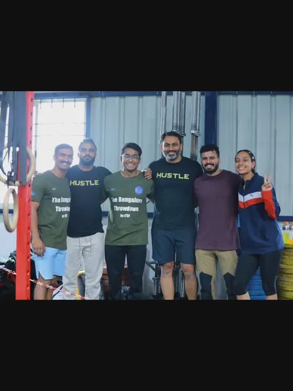 The team and coaches posing together after a tough competition. The support from our coaches and the entire community is a huge part of our members' success.