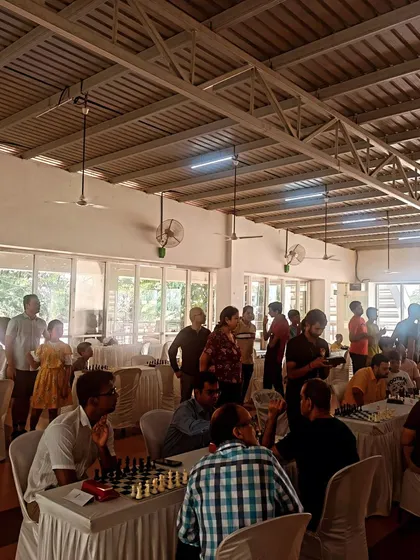 The tournament is in full swing at a community clubhouse. We use the Swiss format to ensure that players are matched with opponents of similar skill levels throughout the event.