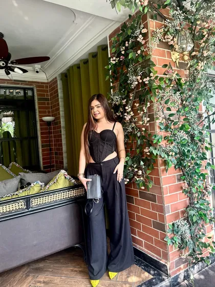 Another pose in my favorite black outfit, set against the beautiful decor of the restaurant.