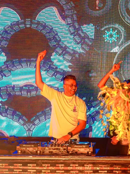 A shot of me celebrating a great night at Bombay Adda, with the club's unique visuals behind me.