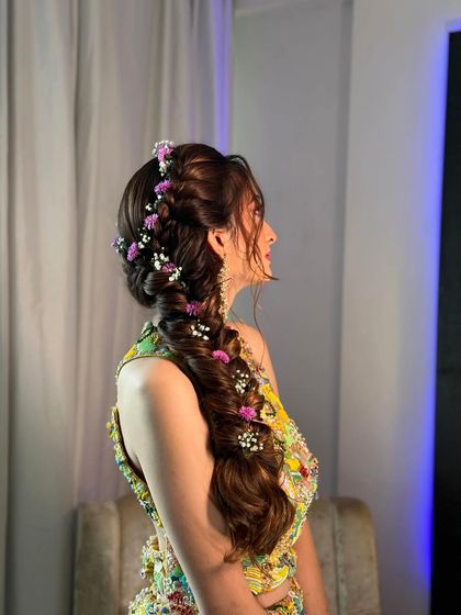 The soft, romantic feel of this side braid is perfect for a bride who wants to look effortlessly beautiful.