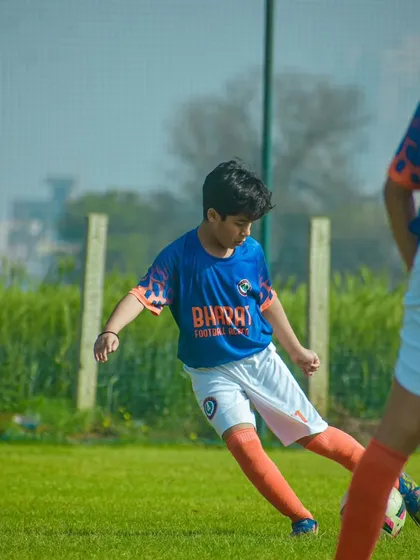 Meet Samarth Jain, a talented left footer with incredible vision. This image shows his focus as a midfield maestro, a skill he has honed over three years with us.