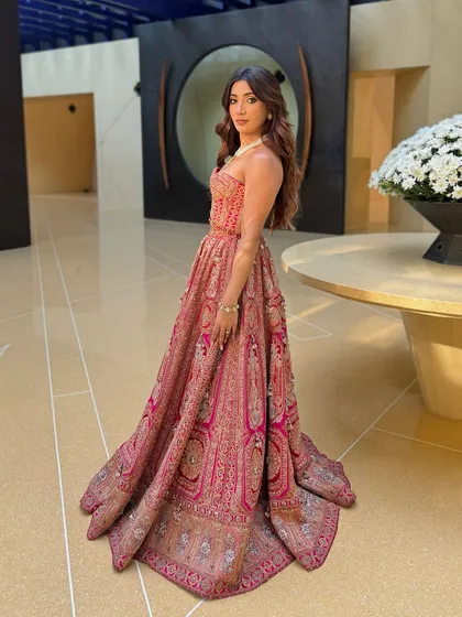A bridal trend alert showcasing a stunning corset blouse paired with a heavily embroidered lehenga. This is a perfect look for a Mehendi or Sangeet.