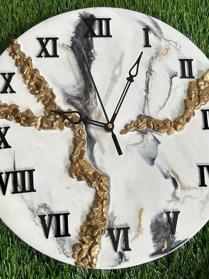 Another angle of the black and white marble clock, showing how the gold crystals catch the light.