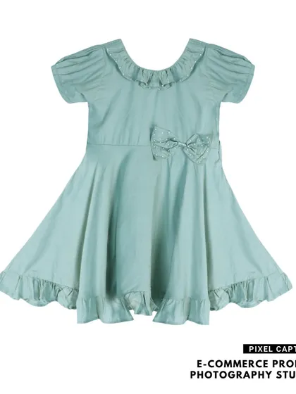 A branded, flat lay photograph of a light green baby frock, perfect for e-commerce listings.