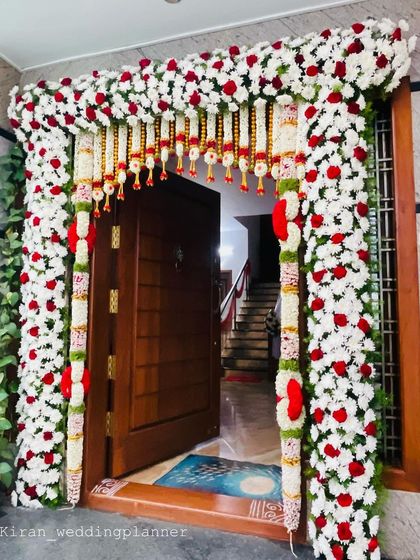 Another angle of the beautiful red and white floral door frame, showing the depth and detail of the flower arrangement.