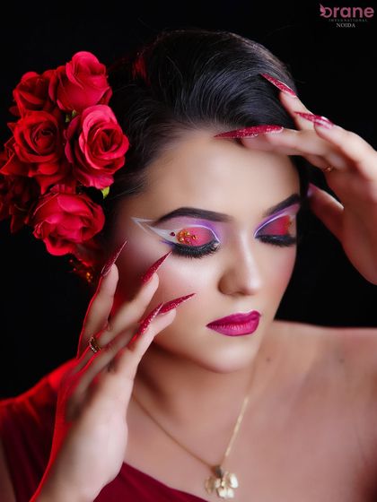 A close-up of the creative eye makeup, featuring a fan-like design and a pop of color.