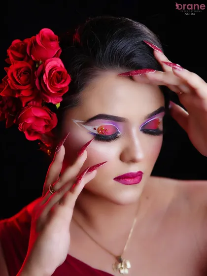 A close-up of the creative eye makeup, featuring a fan-like design and a pop of color.