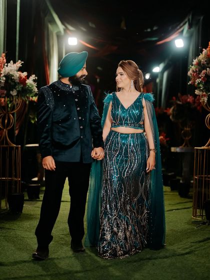 A romantic shot of the couple. The makeup complements her stunning sequined outfit perfectly.