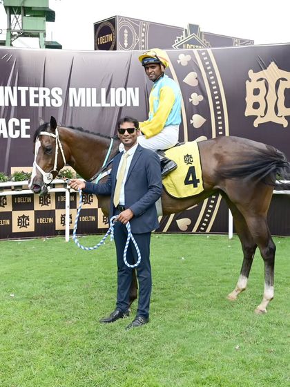 'Indian Brocade', winner of The Deltin Juvenile Sprinters' Million, with owner and jockey.