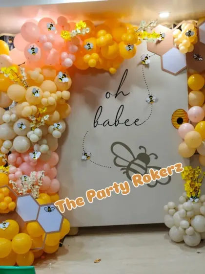 Another view of the honeybee-themed baby shower, showing the cute bee details and the warm color palette.