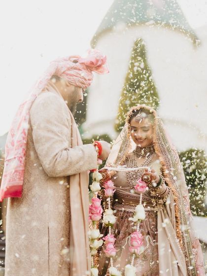 A dreamy, light-filled shot from Vasav's varmala ceremony. Her glowing makeup looks absolutely radiant, even in this artistic, overexposed photo.