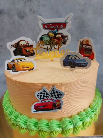 A custom cake featuring characters from Disney's 'Cars' movie. This design includes Lightning McQueen and Mater, making it a wonderful surprise for any child who loves the film.