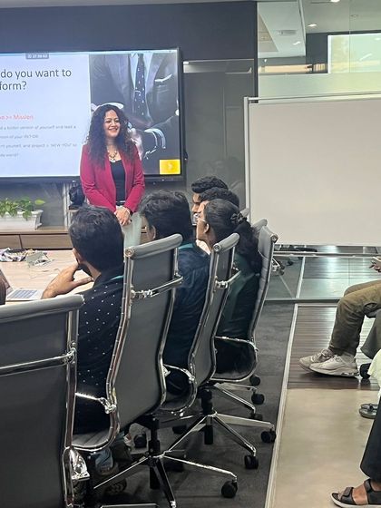 A candid moment during a Q&A segment of a corporate workshop. Creating a comfortable environment where employees feel they can ask questions is key to a successful training session.