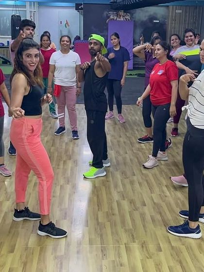 A great action shot from a Zumba class, capturing the movement and fun of the session.