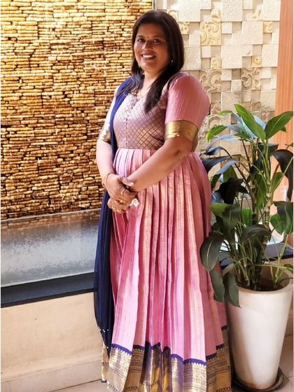Look at this gorgeous client in a dress I converted from one of our semi-Kanchi sarees. This is a perfect example of how we can turn a traditional saree into a modern, elegant outfit.
