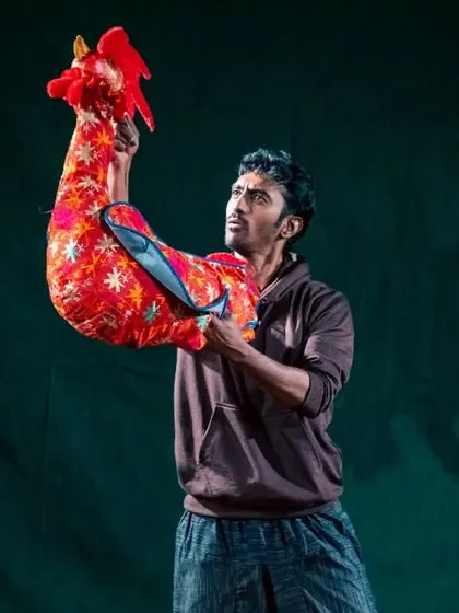 A puppeteer brings a vibrant rooster to life in our production of 'Be Yourself'. This show highlights our commitment to Indian craftsmanship, with each puppet made from unique regional textiles.
