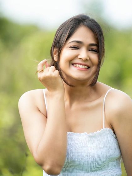 A playful and charming shot, perfect for capturing a youthful and energetic personality.