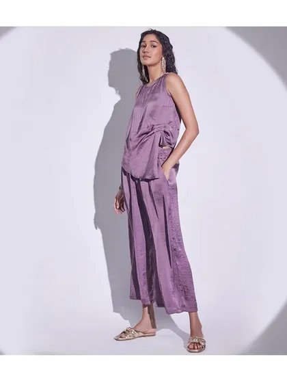 A monochromatic mauve co-ord set styled for a fashion retail campaign. The relaxed fit and satin fabric create a look of effortless lounge luxury.