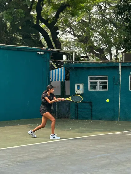 A player hits a powerful forehand during the intense finals of the MSSA tournament.