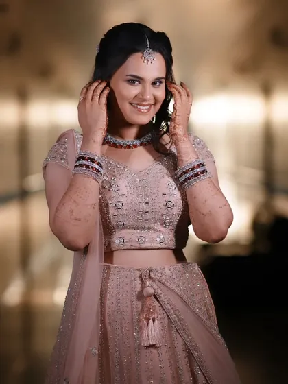 This is a perfect example of a soft and radiant reception look. For Dr. Krishnaveni, I created a natural, skin-like finish that glowed all evening, pairing her beautiful lehenga with a subtle yet elegant makeup style.