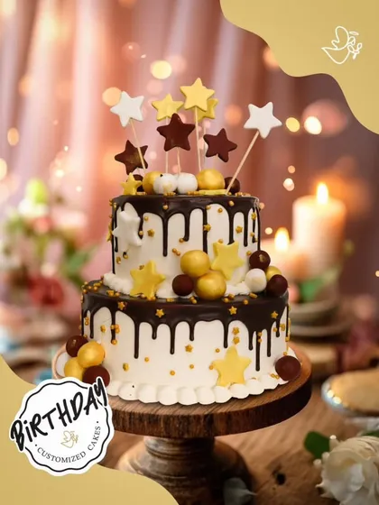 A starry night in chocolate form. This two-tier drip cake is decorated with gold and brown stars, making it a celestial celebration for a special birthday.