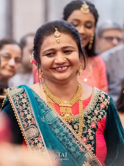 Even through tears, a mother's smile shines with pride and love for her daughter. Capturing this mix of emotions is key to telling the true story of the Bidai.