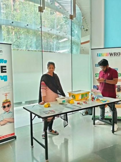 Our setup at the Total Environment, Whitefield promotional event, ready to welcome families and introduce them to the world of LEGO robotics.