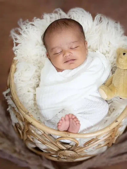 Adding a tiny teddy bear brings an extra touch of sweetness to this newborn portrait. Every snapshot holds endless possibilities for creating a cherished memory.
