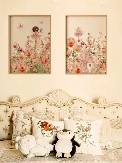 A charming children's bedroom with a button-tufted bed, floral fabrics, and whimsical decor.