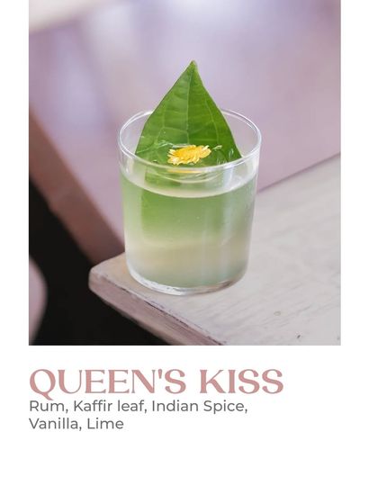 The Queen's Kiss is a highlight of my floral-inspired cocktail collection. It combines rum, kaffir leaf, Indian spice, vanilla, and lime to create an experience as enchanting as a walk through a tropical garden.