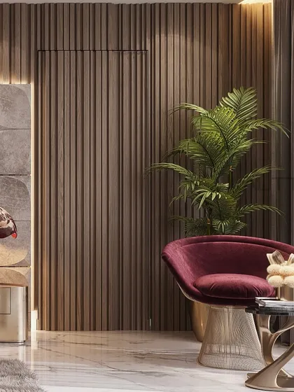 A cozy corner in the upcoming bedroom project, showcasing a burgundy velvet armchair with a brass base. The fluted wood wall and unique table lamp add layers of texture and sophistication.