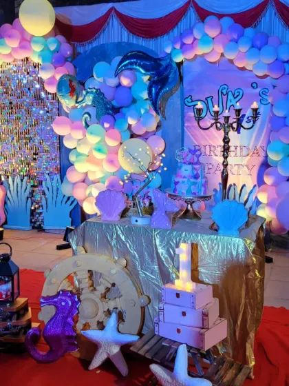 This shot captures the full, enchanting ambiance of the mermaid-themed first birthday party.