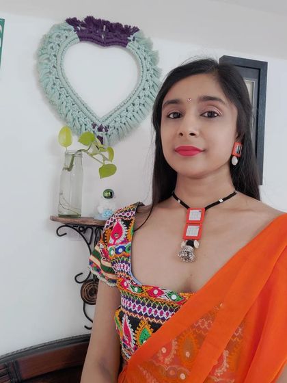 Modeling two of my favorite handmade necklace sets. The first is a bold orange mirror work set for a garba night, and the second is a more subtle blue and white mirror set that pairs beautifully with a silk saree.