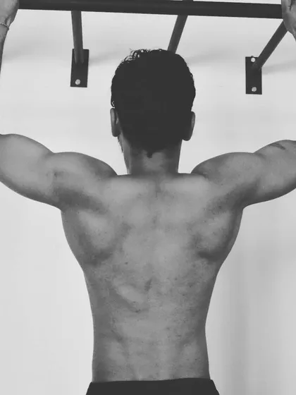 A strong back is essential for grappling and overall posture. Pull-ups are a fundamental bodyweight exercise we use to build that strength. Muscle memory is real, and routine is everything.