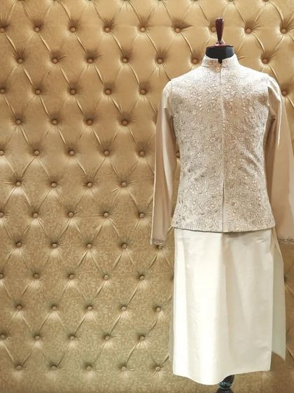 For a more classic vibe, this beige ensemble with a detailed embroidered jacket is a timeless choice that exudes grace.