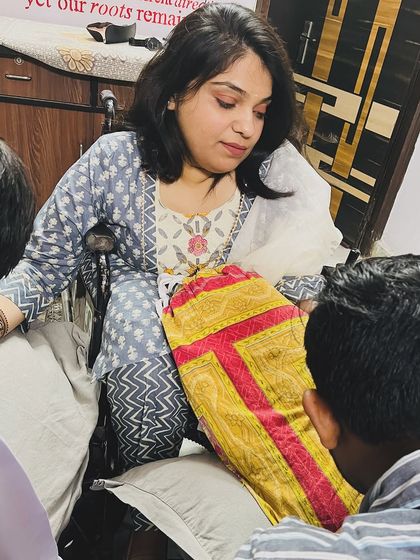 A candid shot of me working with a client, discussing the design and ensuring every detail is perfect.