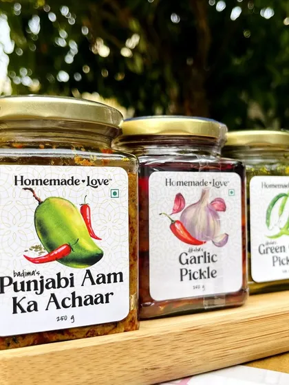 Our star trio, ready for their close up. The classic Punjabi Aam ka Achaar, the bold Garlic Pickle, and the zesty Green Chilli Pickle, each one a favourite.