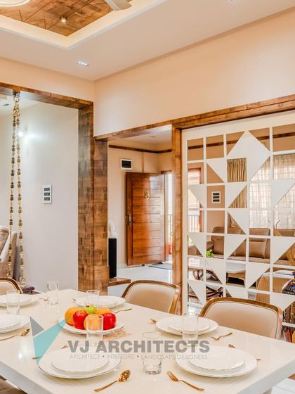 A wider view of the dining and living space, showing the seamless integration of the modern dining set, the traditional swing, and the custom geometric screen.