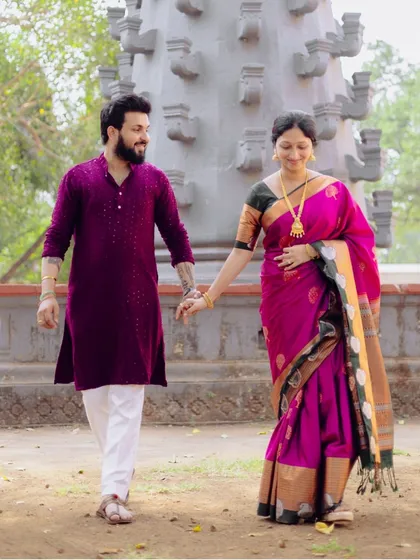 A candid moment of the couple walking hand-in-hand, sharing a smile. These natural interactions are what make a pre-wedding shoot feel authentic.