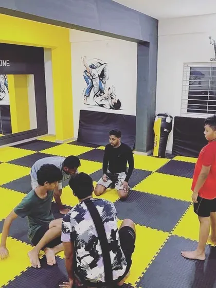 A group of our younger students learning the basics of jiu-jitsu positioning. We keep the classes engaging and focus on learning through drills and games.
