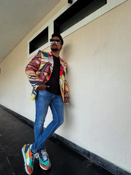 Another angle of my colorful outfit for a poolside event. My style is an extension of the high-energy persona I bring to my hosting.