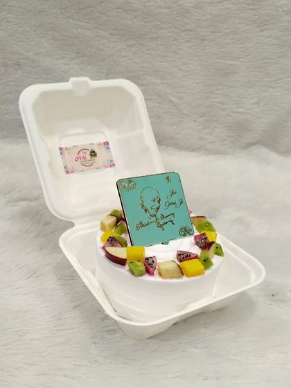 A special bento cake for celebrating Guruji's birthday. This one is a fresh fruit cake, offering a light and refreshing option for devotees.