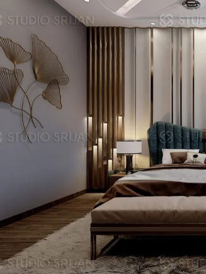 A luxurious bedroom in Alameda, Gurgaon, with a dramatic, backlit wooden feature beside a plush, teal-colored, scalloped headboard.