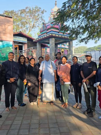 Our team with a revered guru during our visit to Bangalore, a moment of receiving blessings and wisdom.