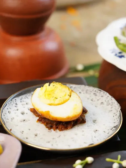 A simple yet elegant starter for our Easter menu. A perfectly boiled egg served on a bed of spicy masala atop a delicate, lacy appam. A single bite packed with flavour.