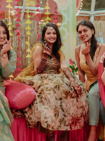 A bride and her friends enjoying the mehndi festivities.