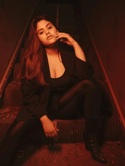 An example of a moody, cinematic portrait created in an unconventional location. Using colored lights on an old escalator, we created a dramatic, story-filled scene with a distinct, edgy vibe perfect for a night photography portfolio.