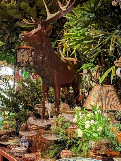 Another detail from the Sabyasachi event, where a majestic deer statue stands amidst a dense arrangement of plants. We used a variety of foliage to surround the decor pieces, making it feel as though guests were exploring a magical, antique-filled forest.